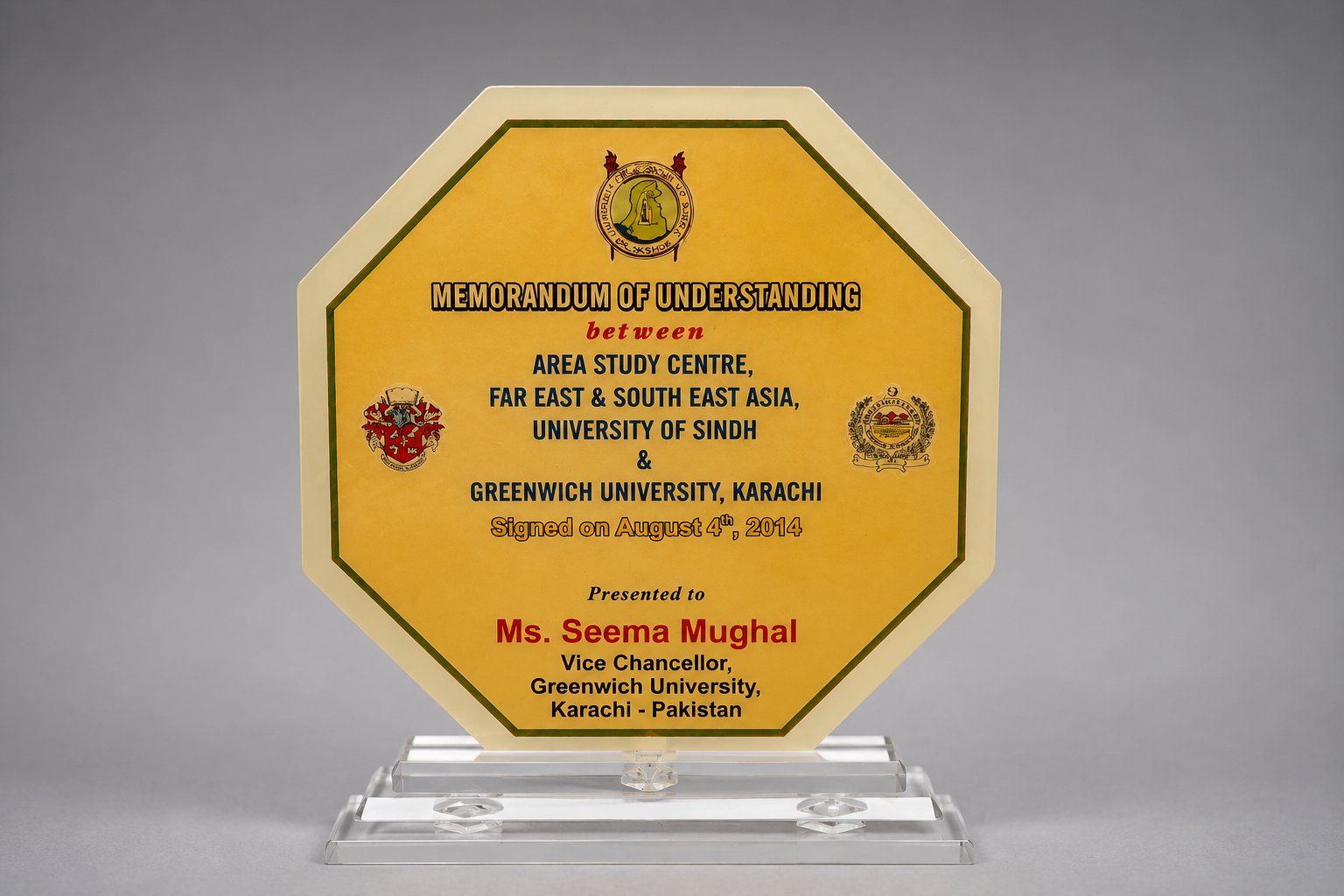 MoU commemoration shield presented to Ms. Seema Mughal, August 2014